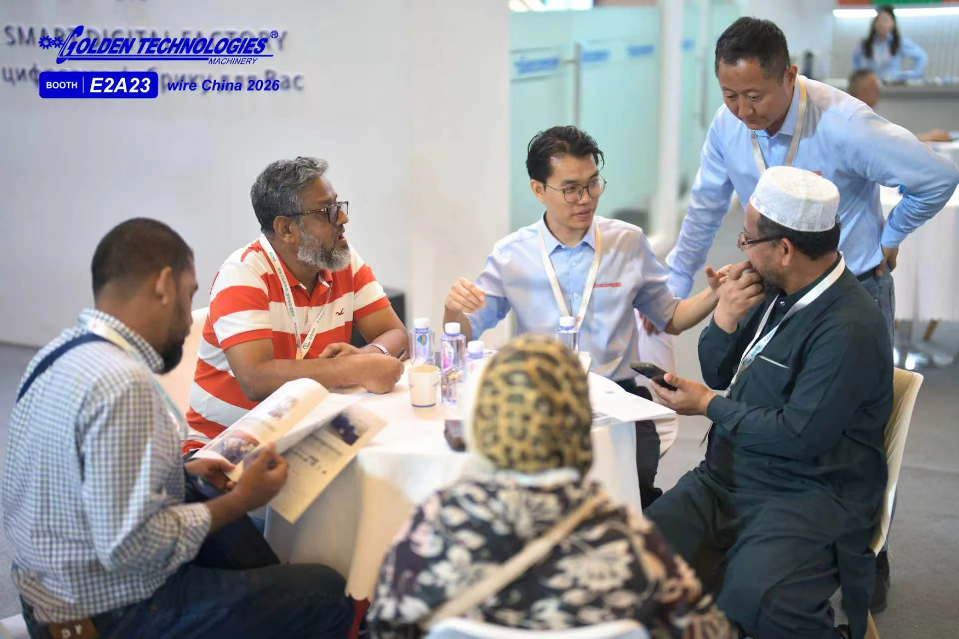 Golden Technologies team discussing cable production requirements with visitors at wire China 2026
