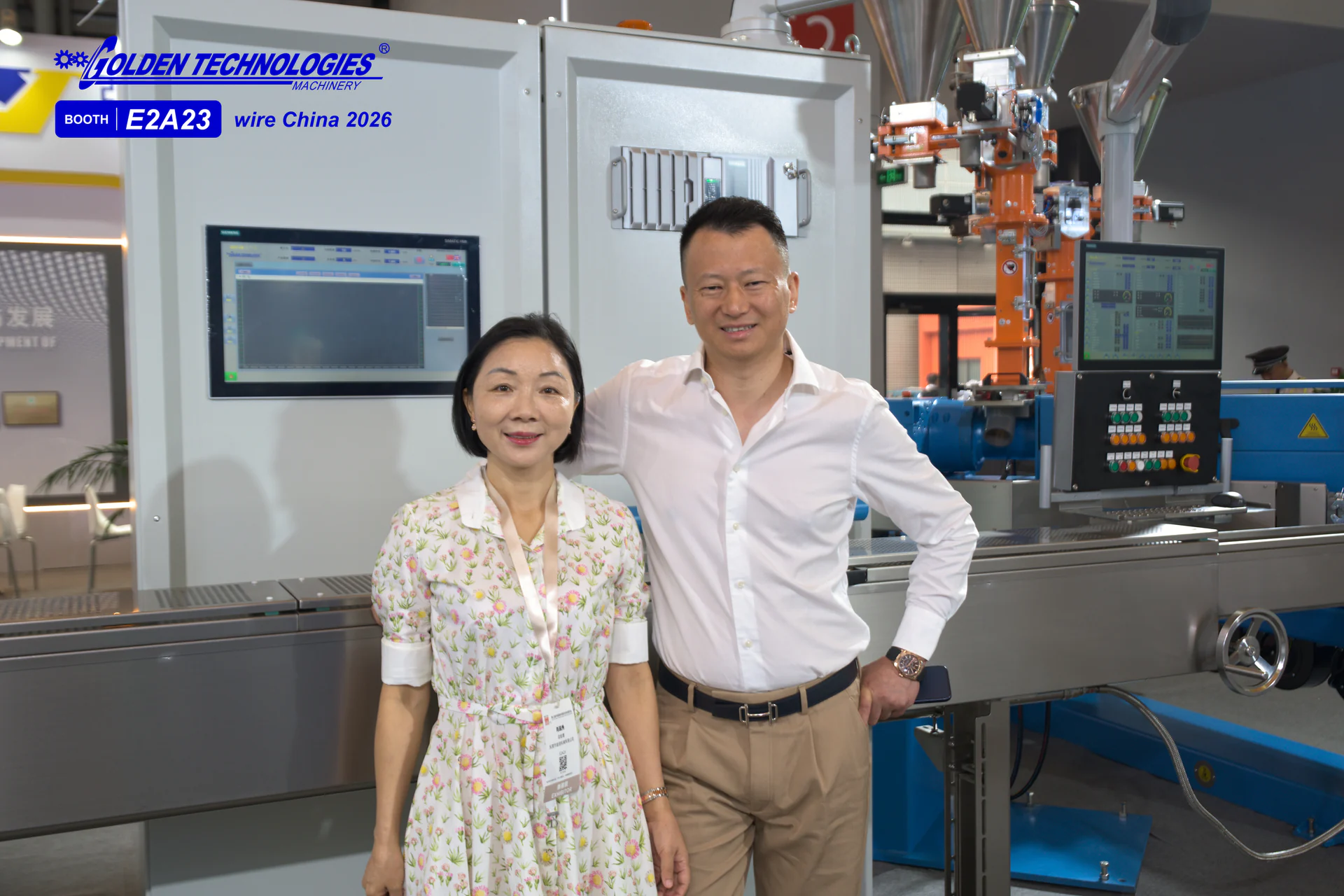 The founders of Golden Technologies in front of extrusion equipment at wire China 2026